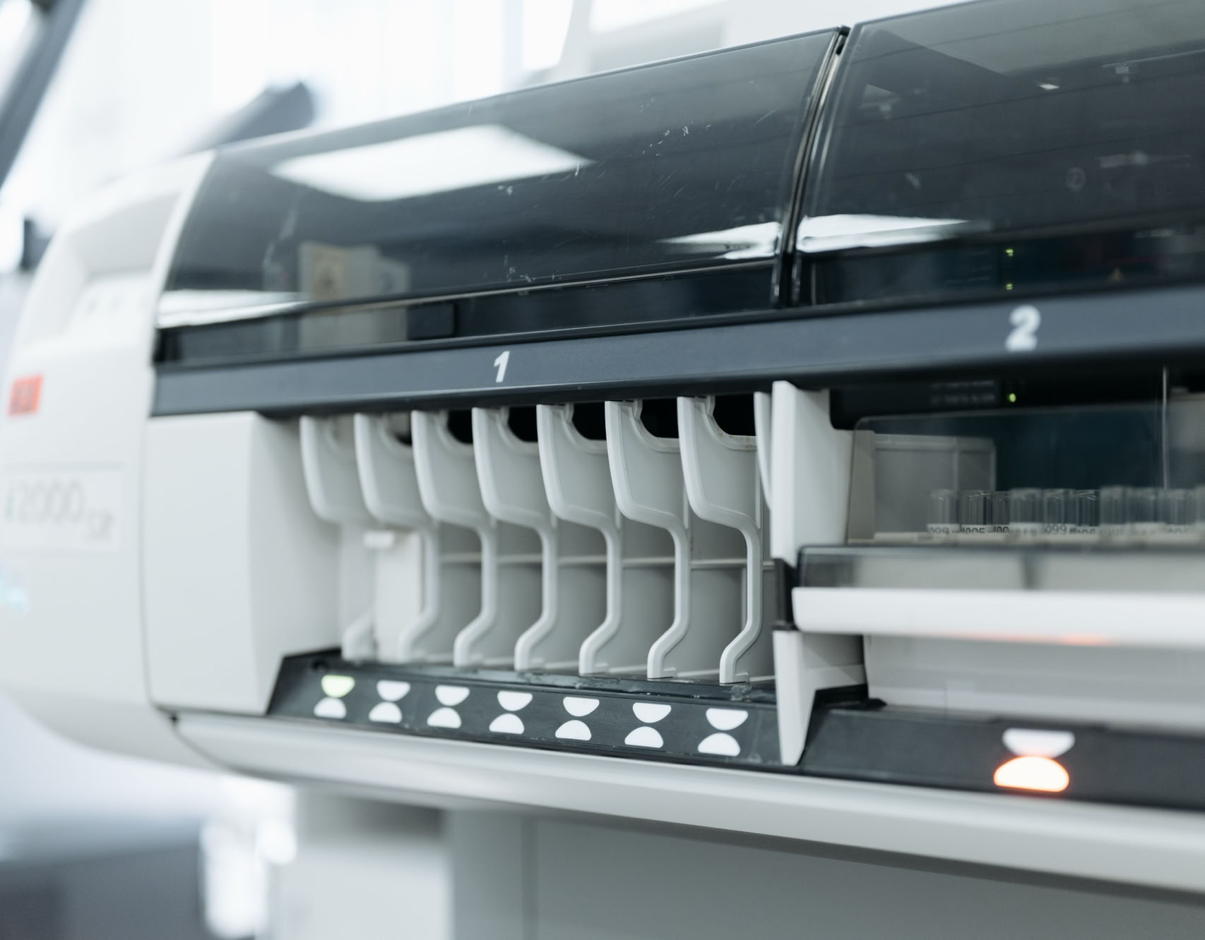 A close-up of advanced laboratory testing equipment used for medical and scientific research in a sterile environment.